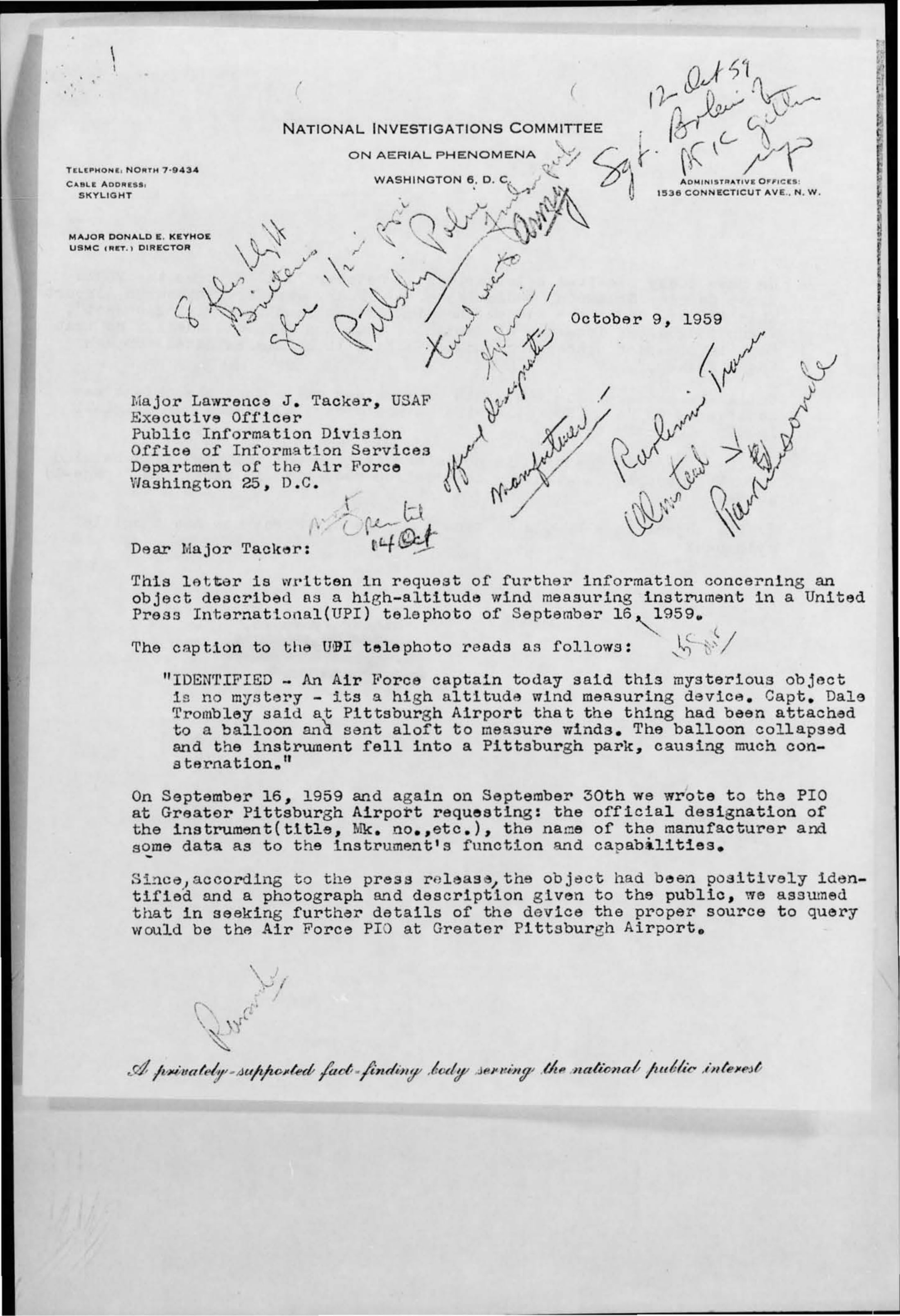 A typed letter on printed letterhead, photographed from microfilm. Across the upper half, several different hands have written in pencil and ink at varying angles - a dated initialling at the top right, short instructions and queries diagonally across the centre, and a note beside the salutation. The typed body begins below.